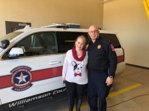 First-time mom Megan with Bryan, the paramedic who saved her life as an infant