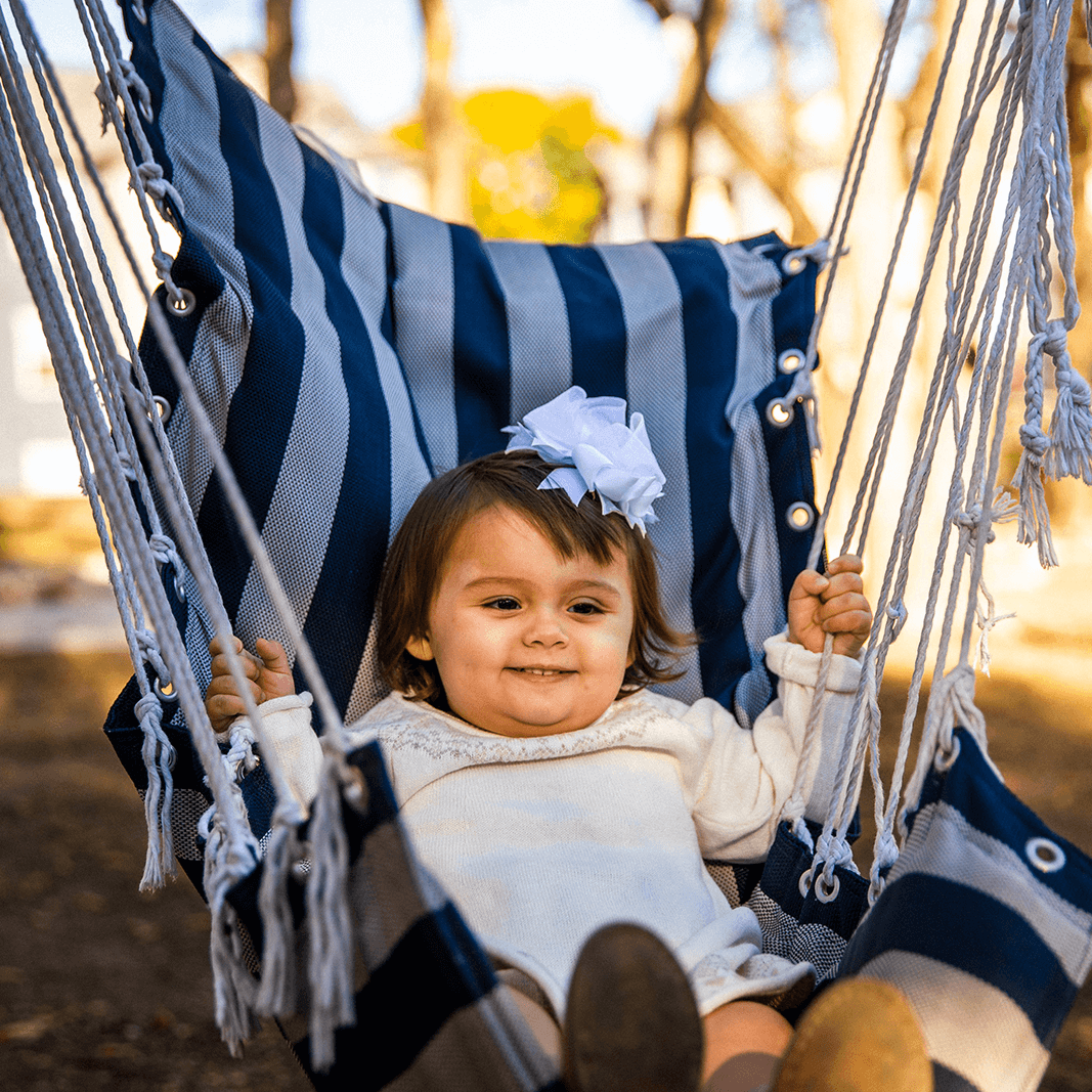 Baby girl in swing