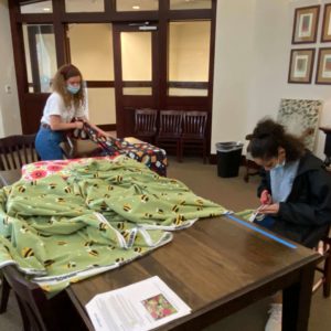 Any Baby Can volunteers making blankets to support our programs.