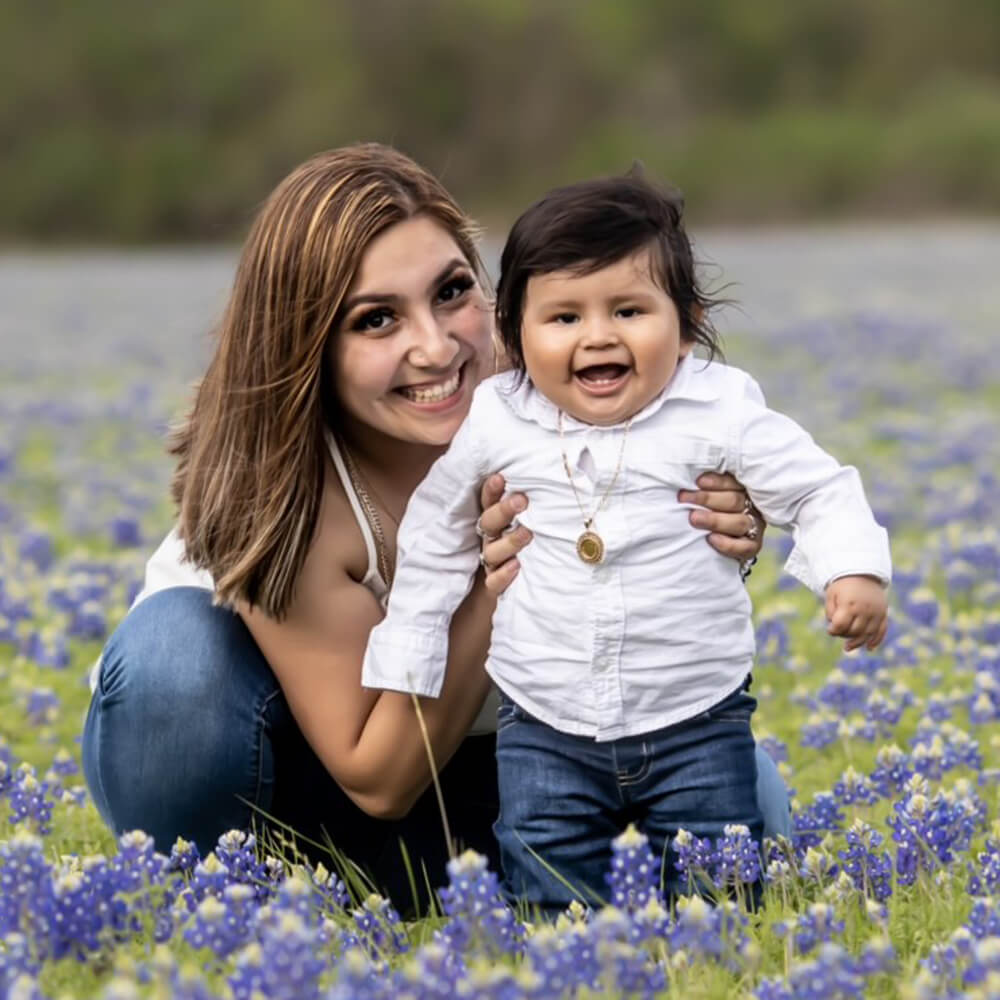 Mom and baby in bluebonnets