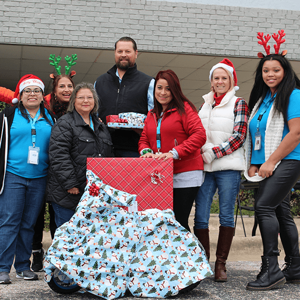 Group with gifts at Adopt-a-Family