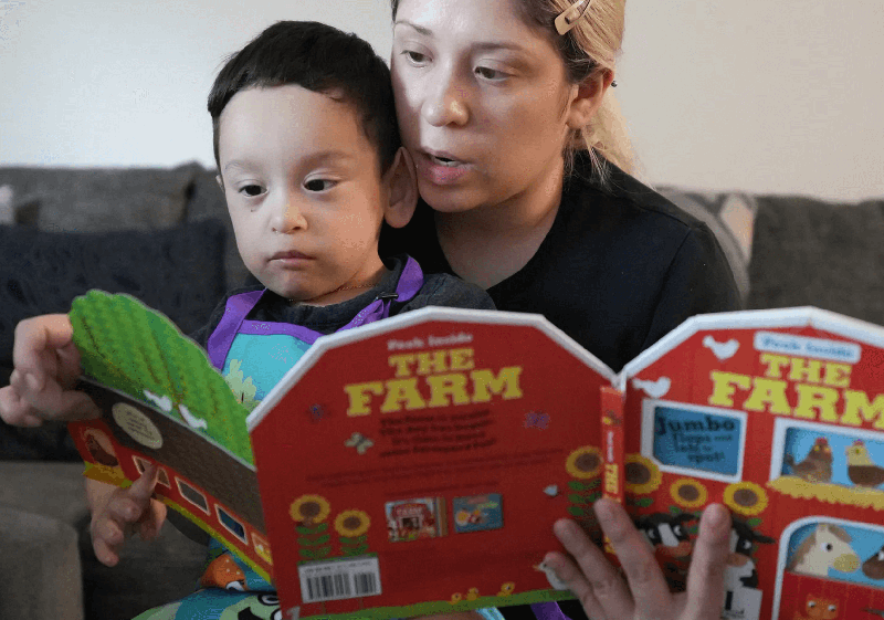 Mom reading to son